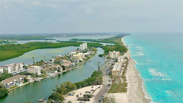 bird's eye view featuring a view of the beach and a water view