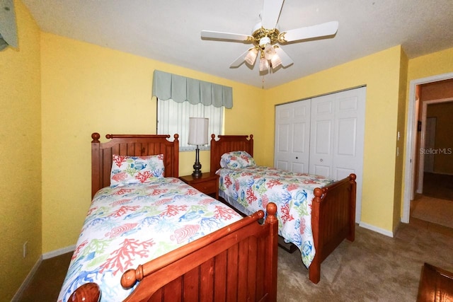 carpeted bedroom featuring a closet and ceiling fan