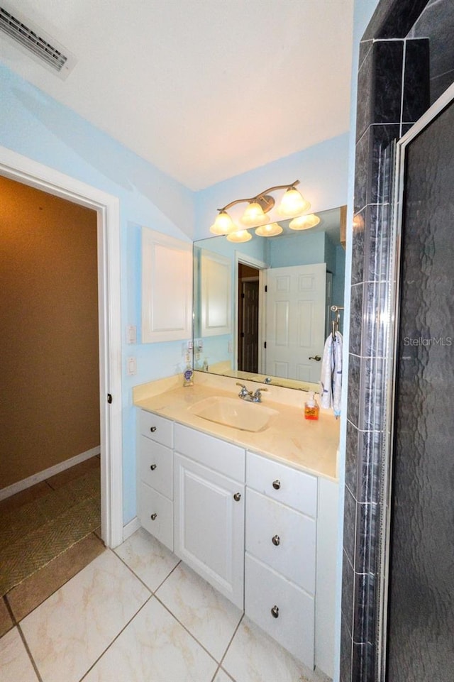 bathroom with walk in shower, tile floors, and large vanity