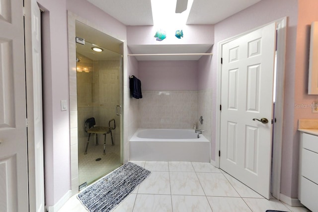 bathroom featuring vanity, plus walk in shower, and tile flooring