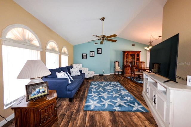 living room with vaulted ceiling, dark hardwood / wood-style flooring, and ceiling fan with notable chandelier