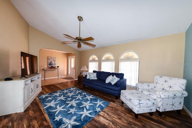 living room with vaulted ceiling, dark hardwood / wood-style flooring, and ceiling fan