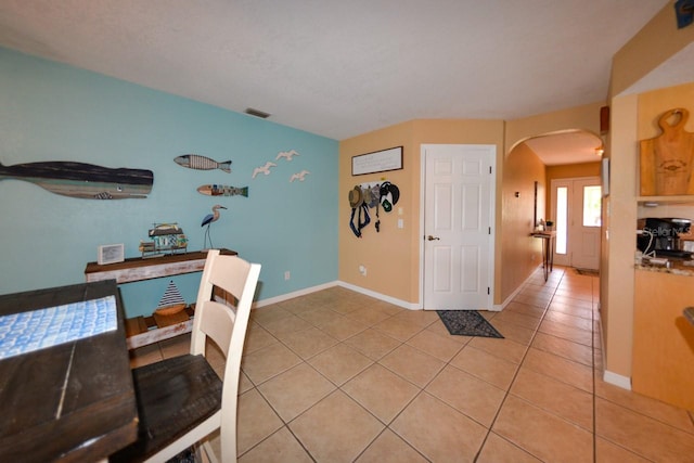 interior space featuring light tile flooring