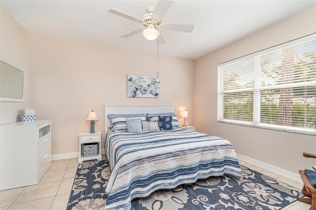 tiled bedroom with ceiling fan