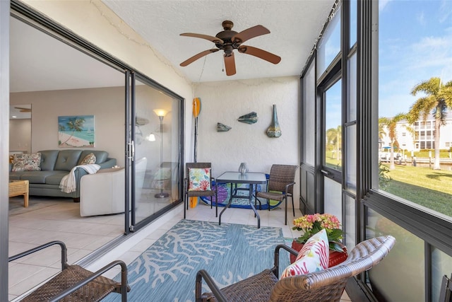 sunroom / solarium with ceiling fan