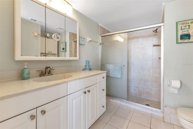 bathroom with toilet, tile floors, a shower with shower door, and oversized vanity