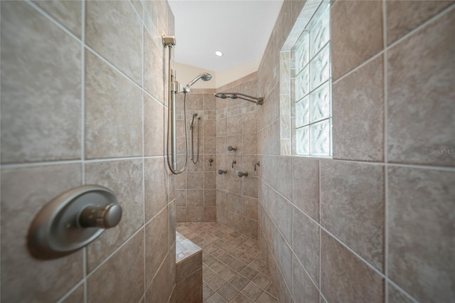 bathroom with a tile shower