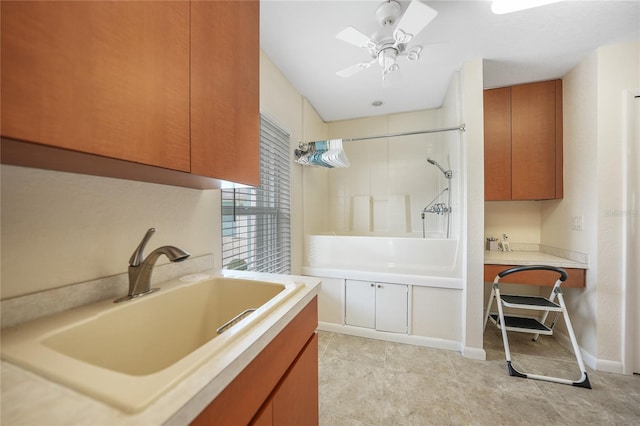 bathroom featuring tile flooring, ceiling fan, and sink