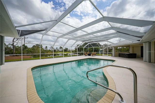 view of swimming pool featuring a lanai and a patio area