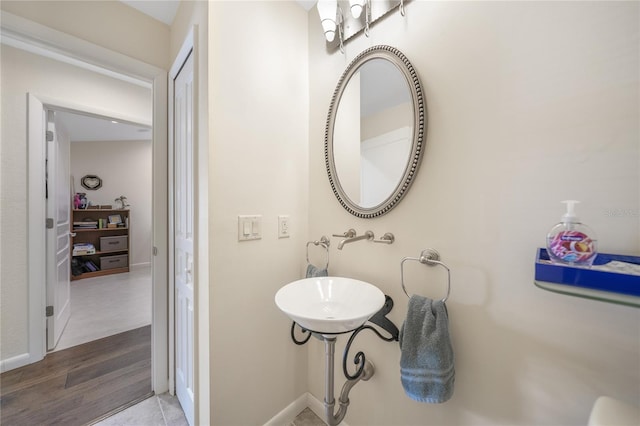 bathroom with hardwood / wood-style floors