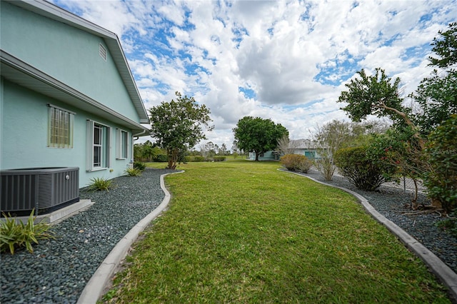 view of yard with central AC