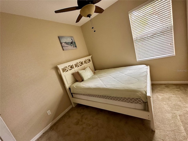 bedroom featuring ceiling fan and carpet floors