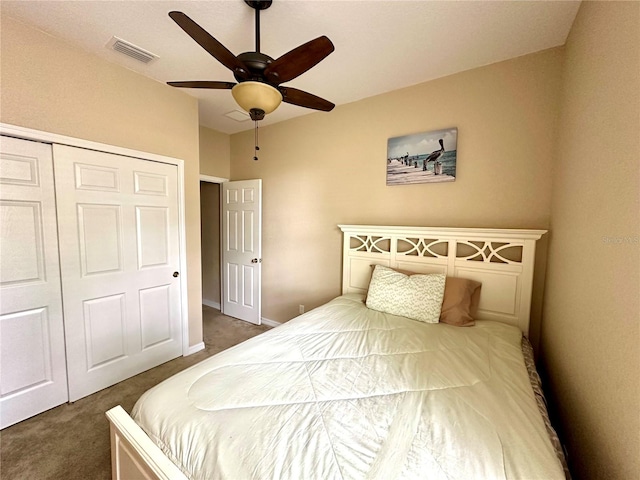 carpeted bedroom featuring ceiling fan and a closet