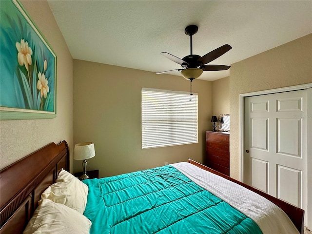 bedroom featuring a closet and ceiling fan