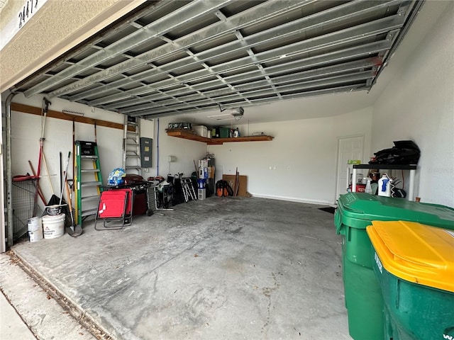 garage with gas water heater and electric panel