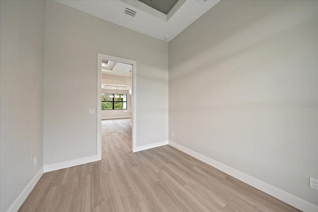 unfurnished room with light hardwood / wood-style floors