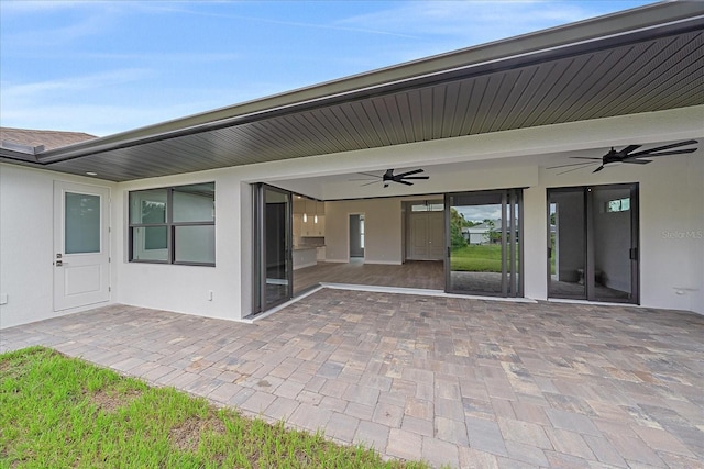 exterior space with ceiling fan