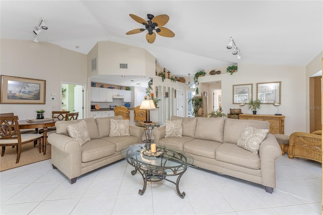 living room with rail lighting, light tile flooring, and ceiling fan