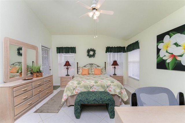 tiled bedroom featuring lofted ceiling and ceiling fan