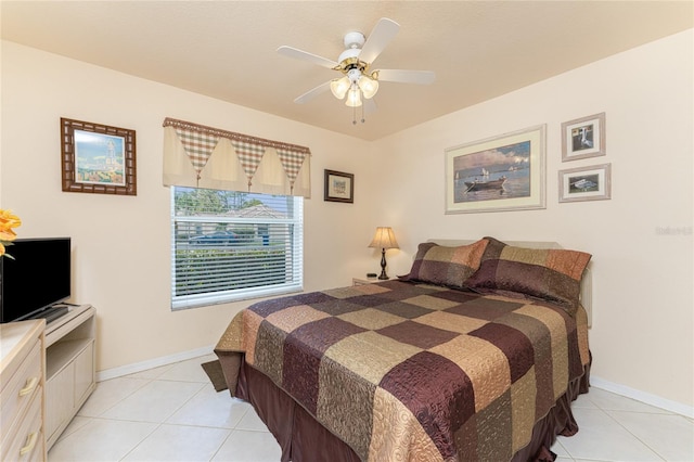 bedroom with light tile flooring and ceiling fan