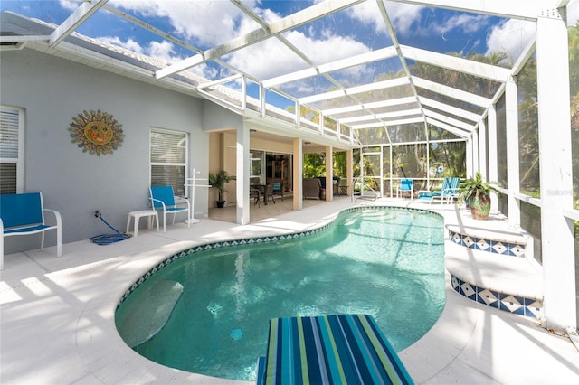 view of pool featuring a patio area and a lanai