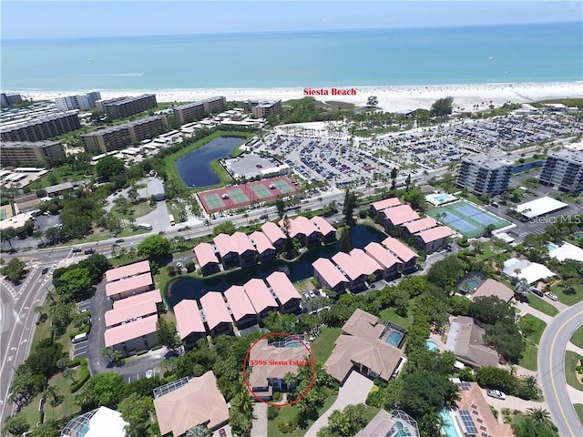 drone / aerial view with a view of the beach and a water view