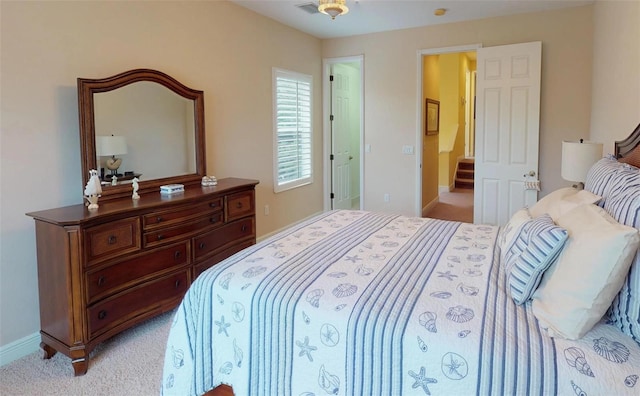 bedroom with light colored carpet