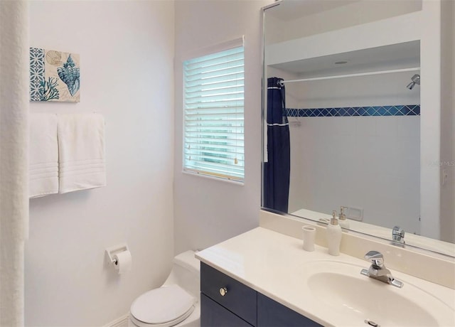 bathroom with vanity, toilet, and a shower with curtain