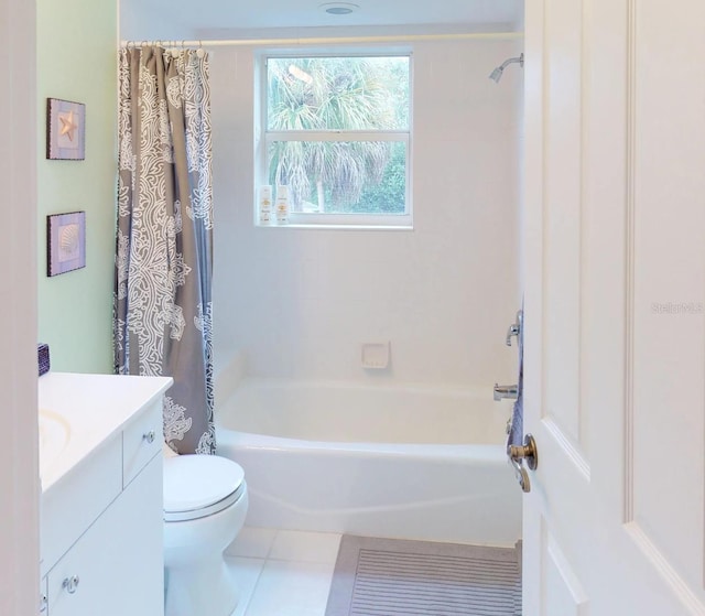 full bathroom with vanity, shower / tub combo, toilet, and tile patterned floors