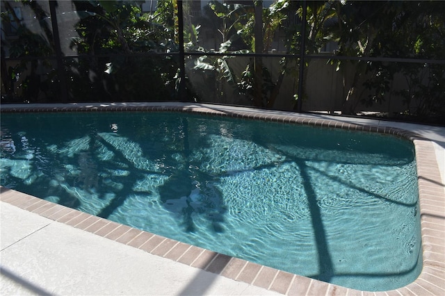 view of pool with a lanai