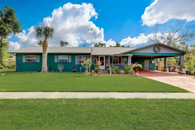 ranch-style home featuring a front lawn, covered porch, and a carport