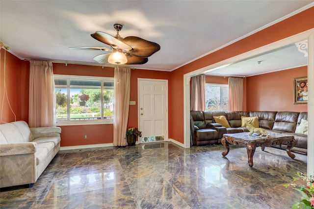 living room featuring ornamental molding and ceiling fan