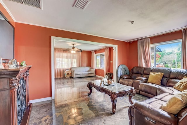 tiled living room featuring plenty of natural light, ornamental molding, and ceiling fan