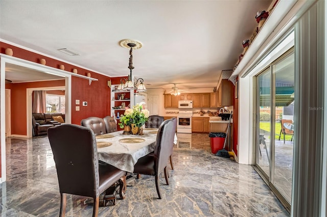 dining room with light tile floors and ceiling fan with notable chandelier