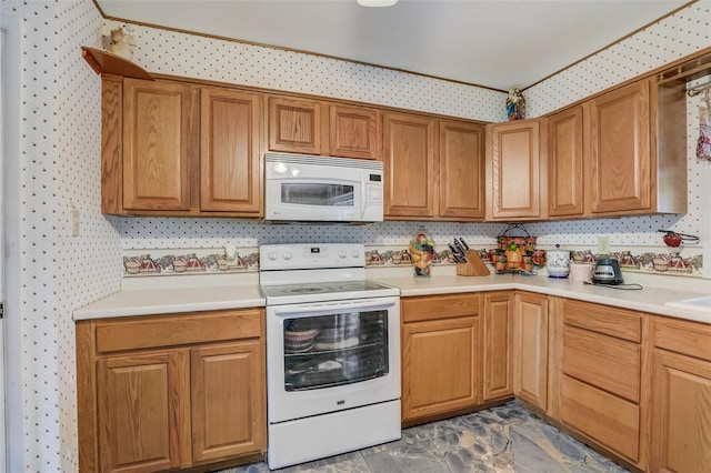 kitchen with dark tile floors and white appliances