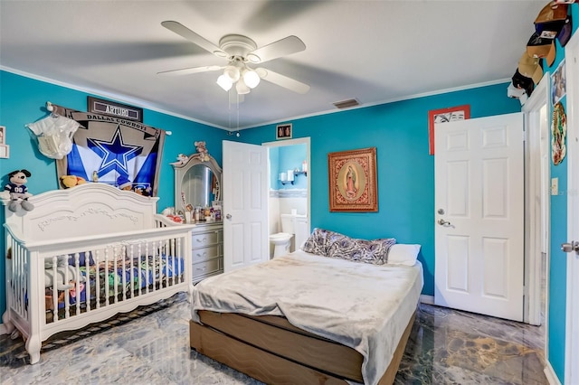 bedroom with dark tile flooring, ceiling fan, and ensuite bathroom