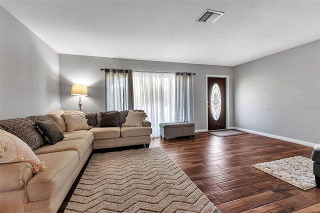 living room with dark hardwood / wood-style floors