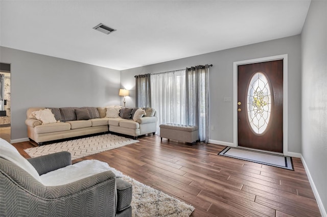 living room featuring dark hardwood / wood-style flooring