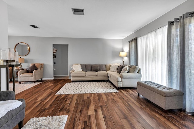 living room featuring dark hardwood / wood-style flooring