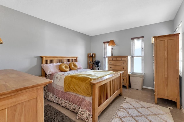 bedroom featuring light tile floors