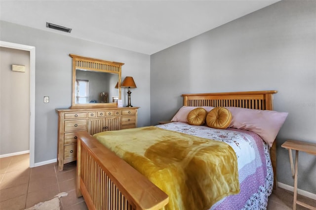 bedroom with light tile floors