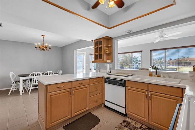 kitchen featuring white dishwasher, light tile floors, sink, and ceiling fan with notable chandelier