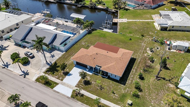 birds eye view of property with a water view