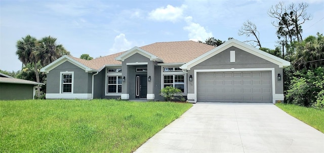 view of front of home with a garage and a front lawn