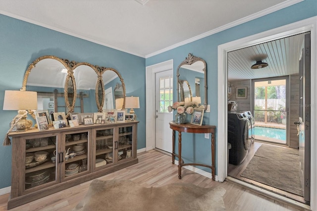 interior space featuring crown molding, light hardwood / wood-style floors, and a healthy amount of sunlight