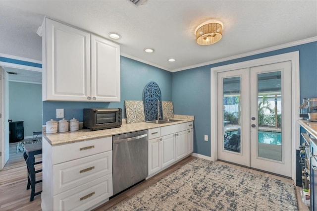 kitchen featuring light hardwood / wood-style floors, white cabinets, dishwasher, french doors, and ornamental molding