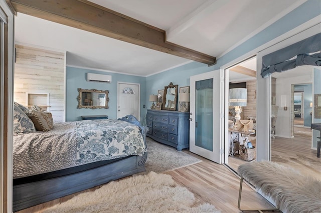 bedroom featuring wood walls, beam ceiling, light hardwood / wood-style flooring, crown molding, and a wall unit AC