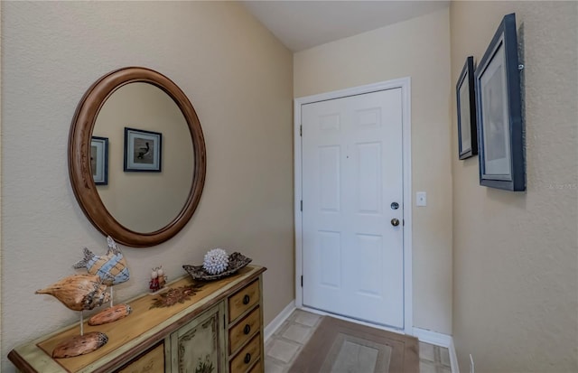 entryway featuring light tile floors