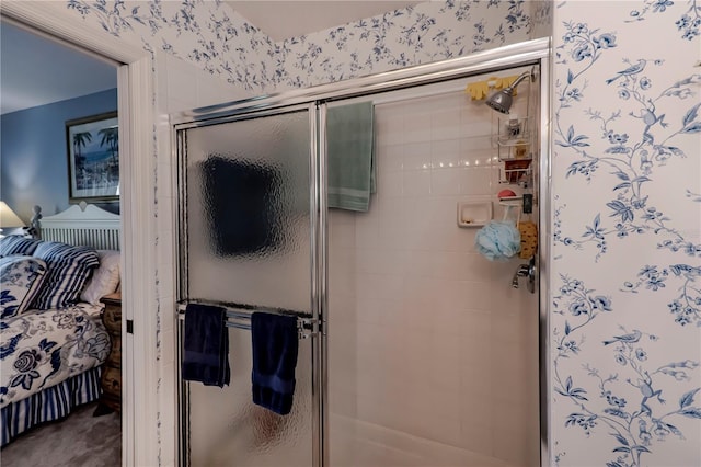 bathroom with a shower with shower door