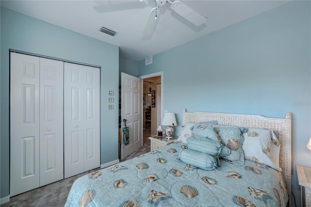 bedroom with a closet, light carpet, and ceiling fan